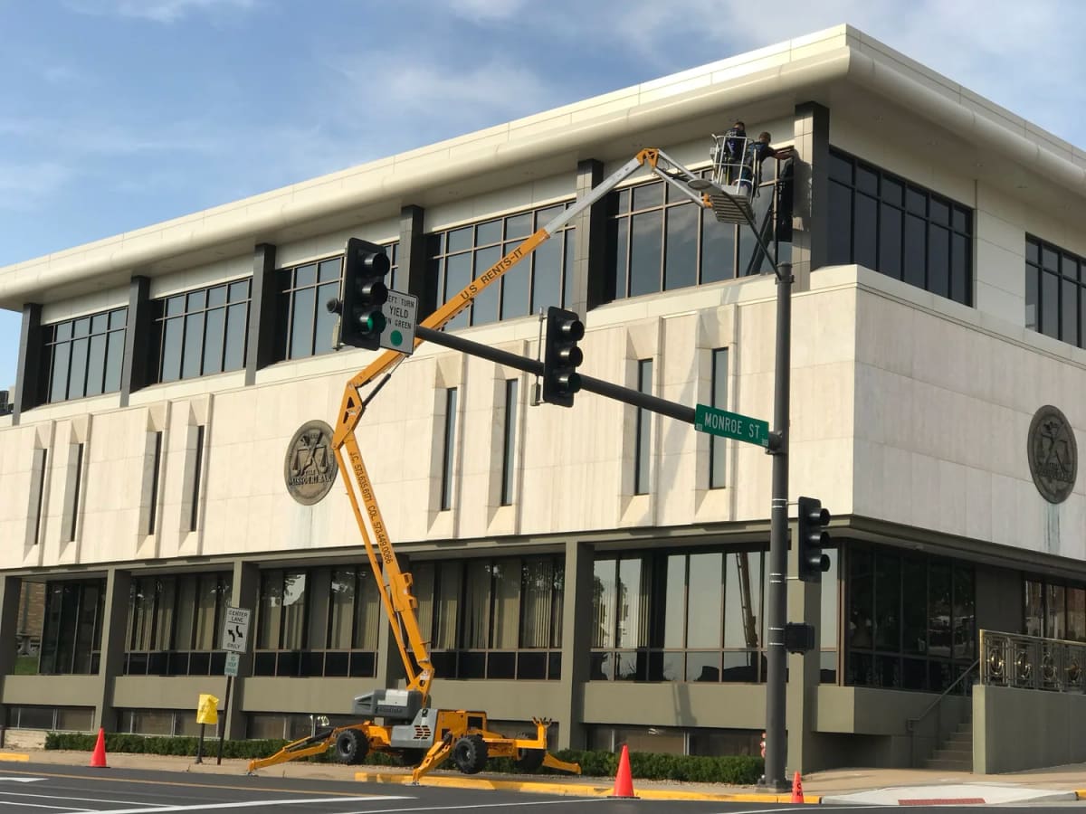 Wash Authority crew on a lift washing a downtown office building in Jefferson City, MO